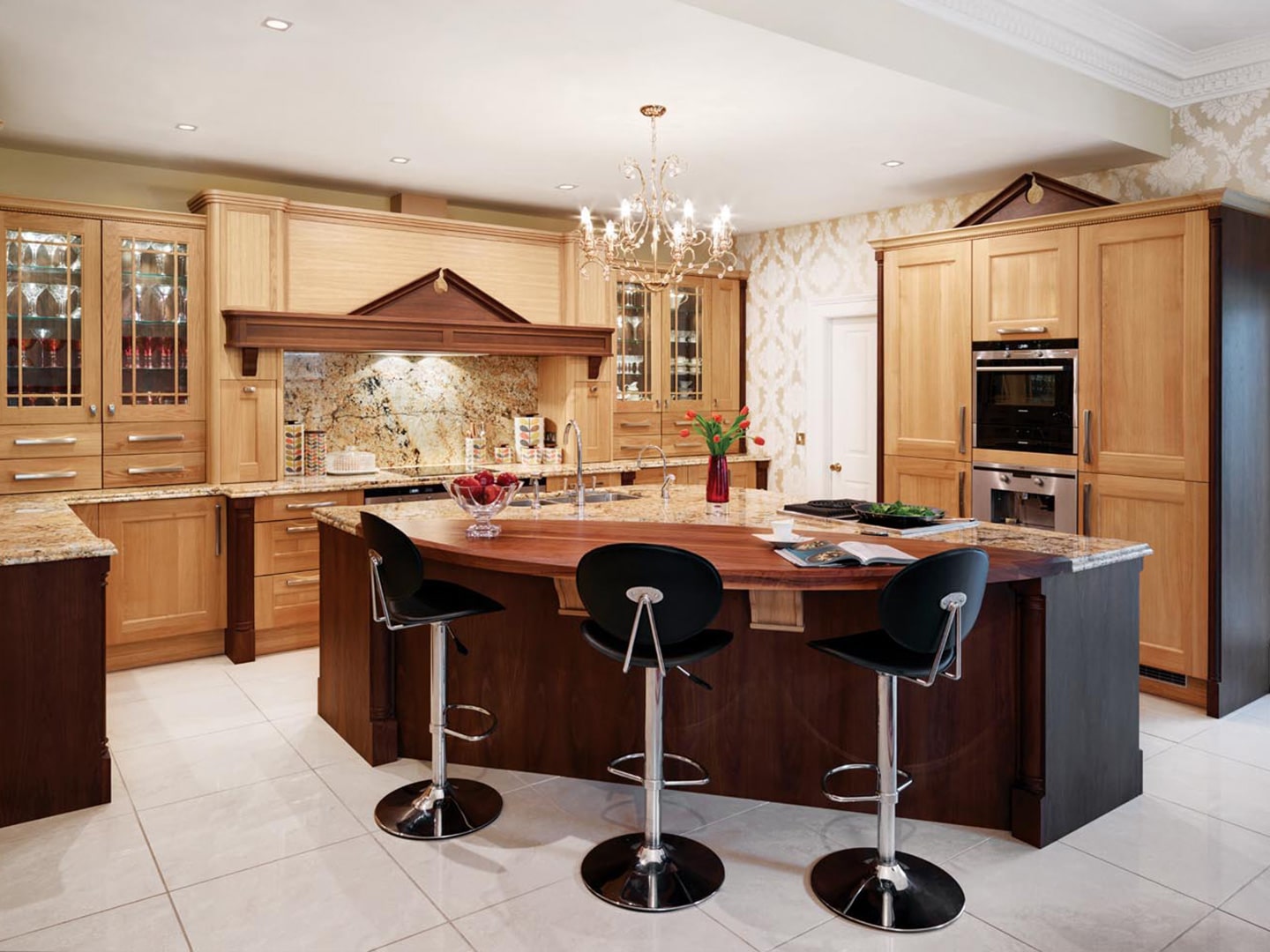 Light brown wooden finish Callerton kitchen with breakfast bar and bar stools