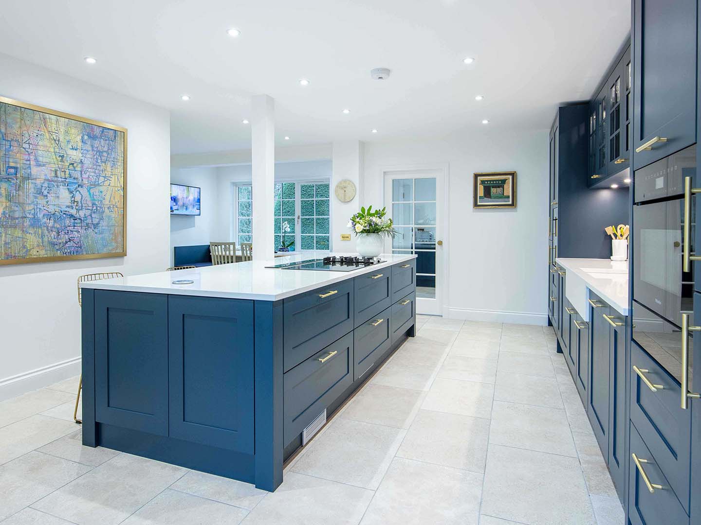 Blue Callerton kitchen cupboards paired with white marble worktop, showcasing kitchen island