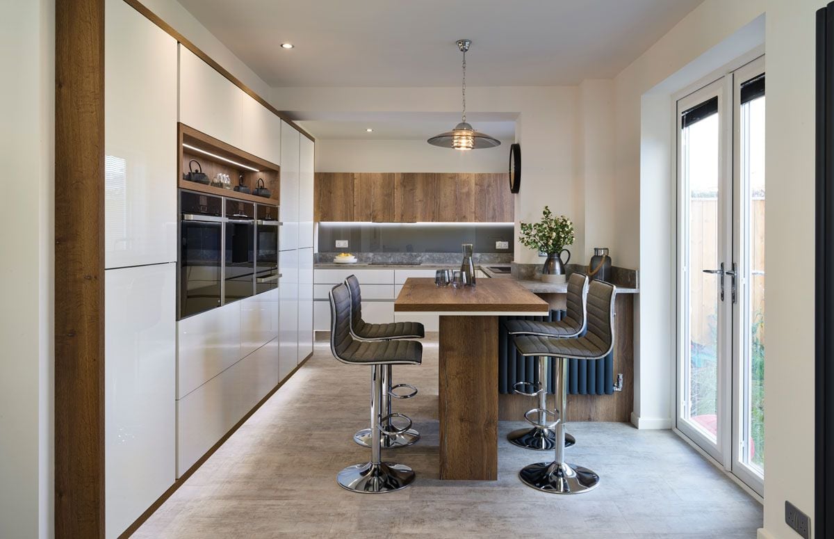 Sleek floor to ceiling kitchen cabinets from Kitchens by JS Geddes